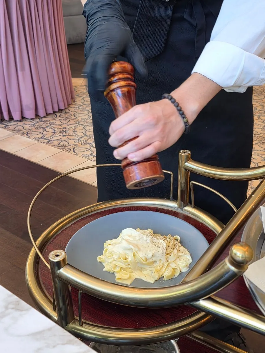 A bowl of cheese-wheel tagliatelle