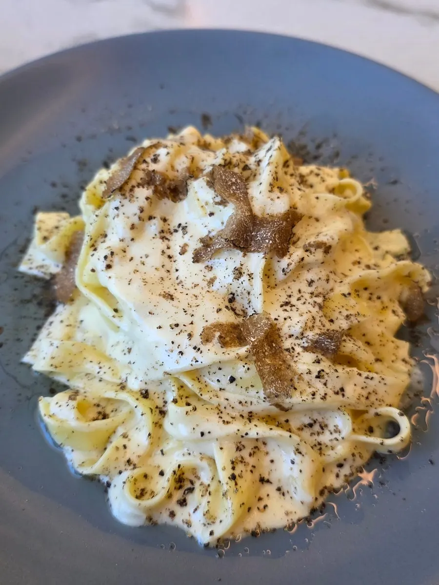 Enjoying cheese-wheel pasta