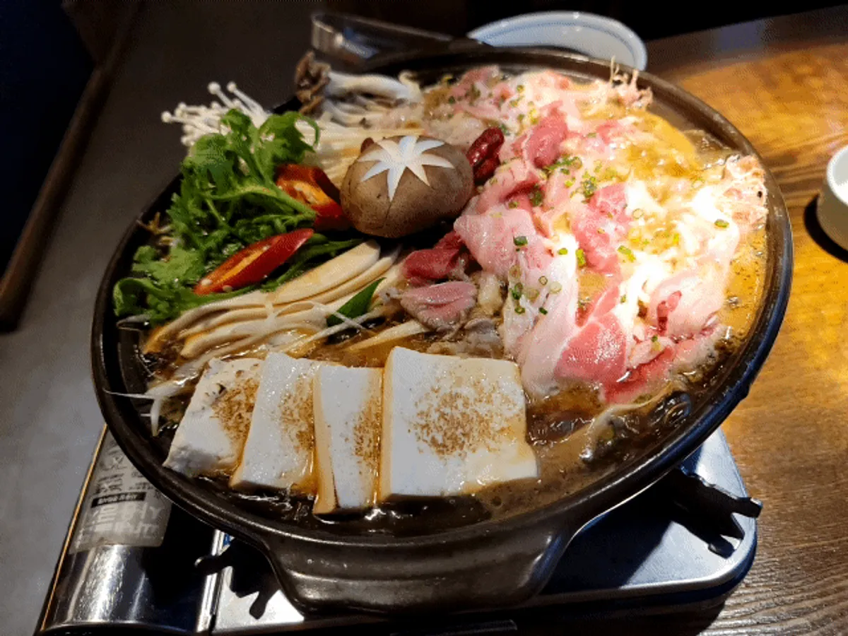 Beef sukiyaki hot pot piled high with beef and vegetables