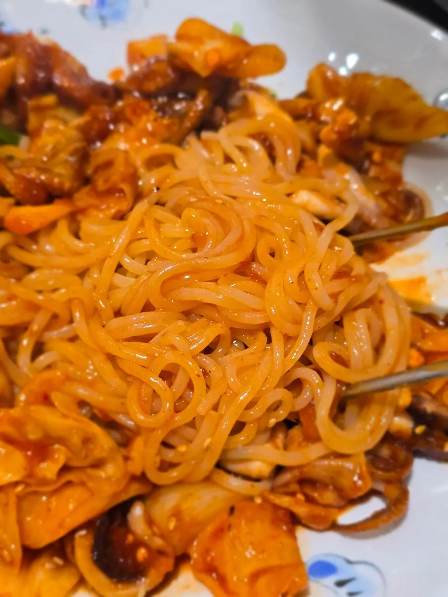 Jjolmyeon noodles mixed into the octopus sauce