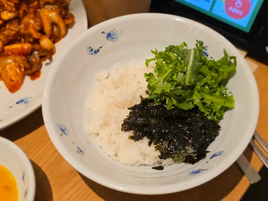 Large bowl with seaweed flakes and vegetables for bibimbap