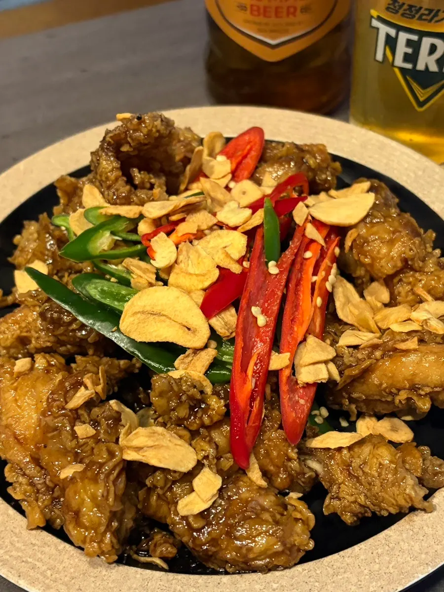 Close-up of freshly fried black garlic fried chicken