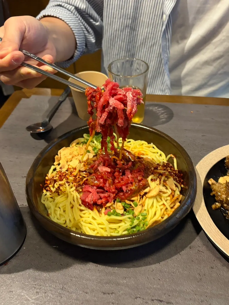 Pasta-like noodles in the spicy tartare bibim noodles