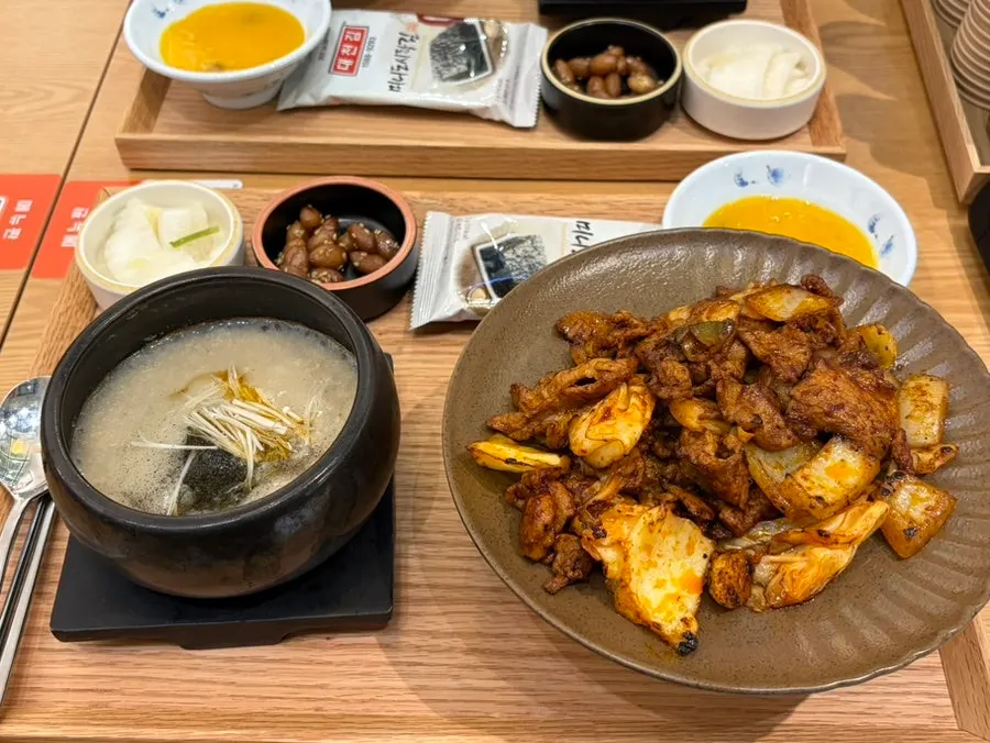 Full table spread of the octopus stir-fry set and pork stir-fry set