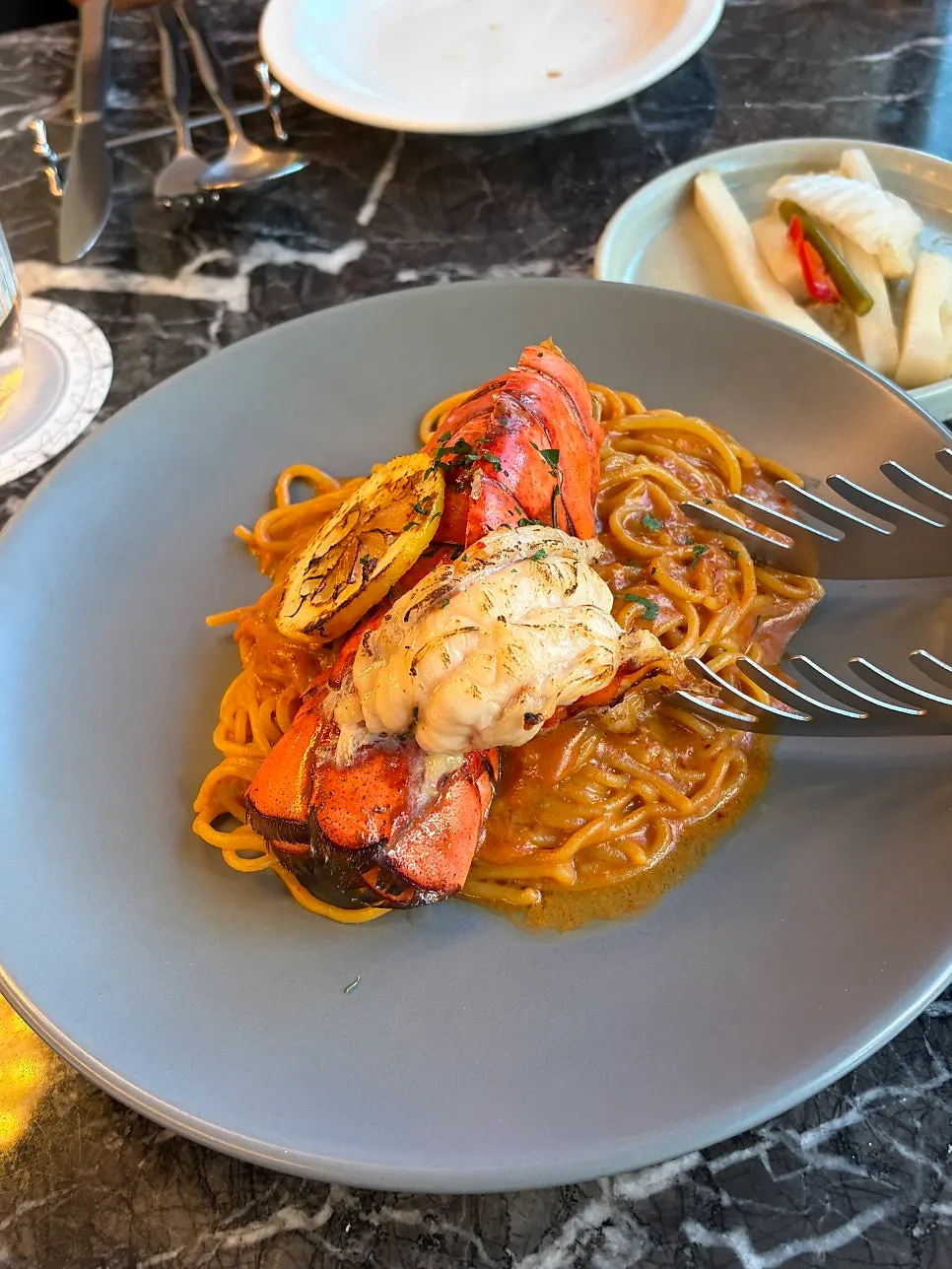 Pasta and steak ordered on the tablet