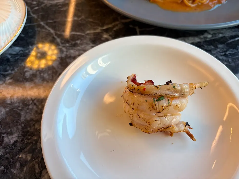 Bisque spaghettini topped with a lobster tail