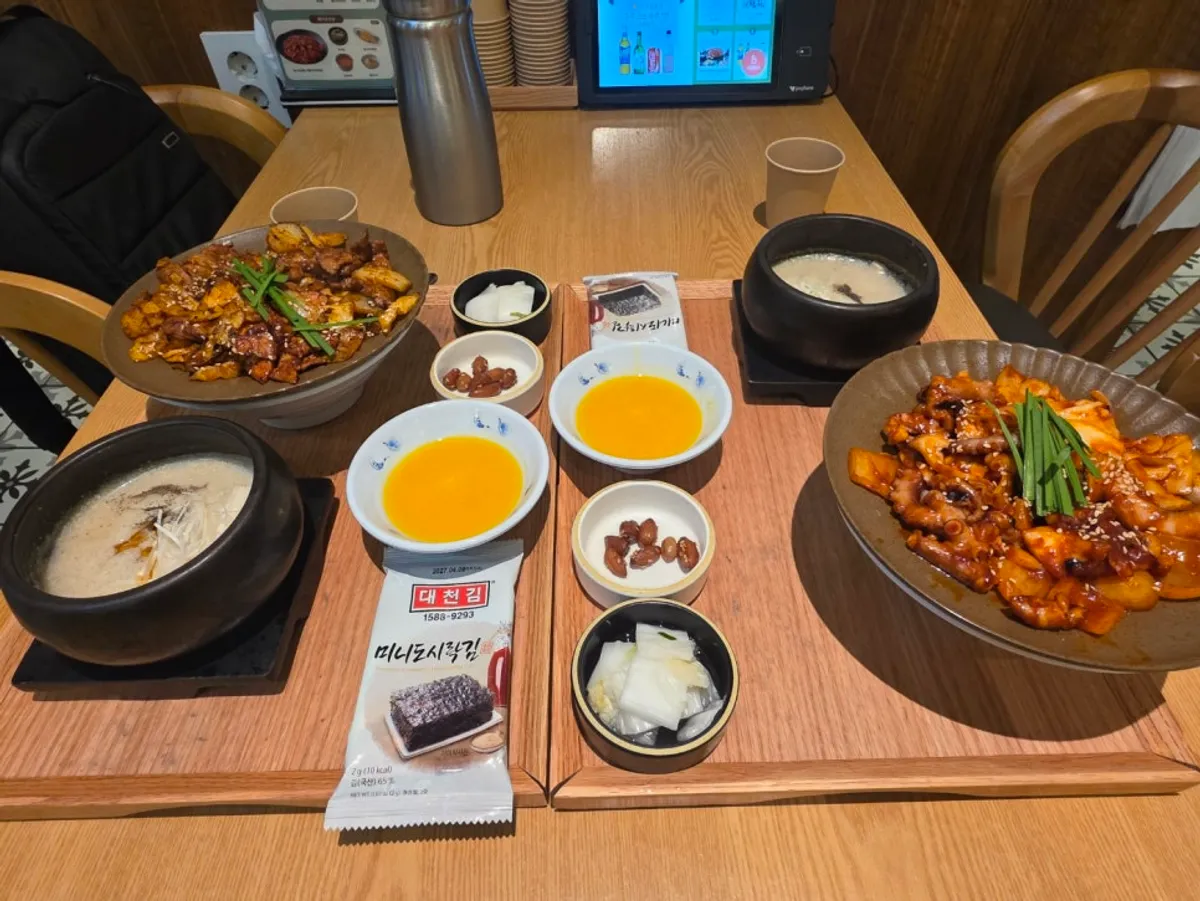 Table spread of octopus stir-fry set and pork stir-fry set