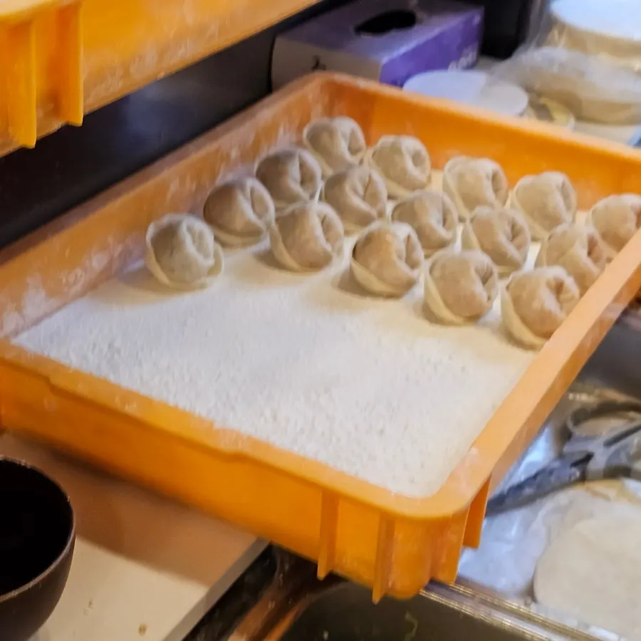 Work station where dumplings are hand-pinched in-store
