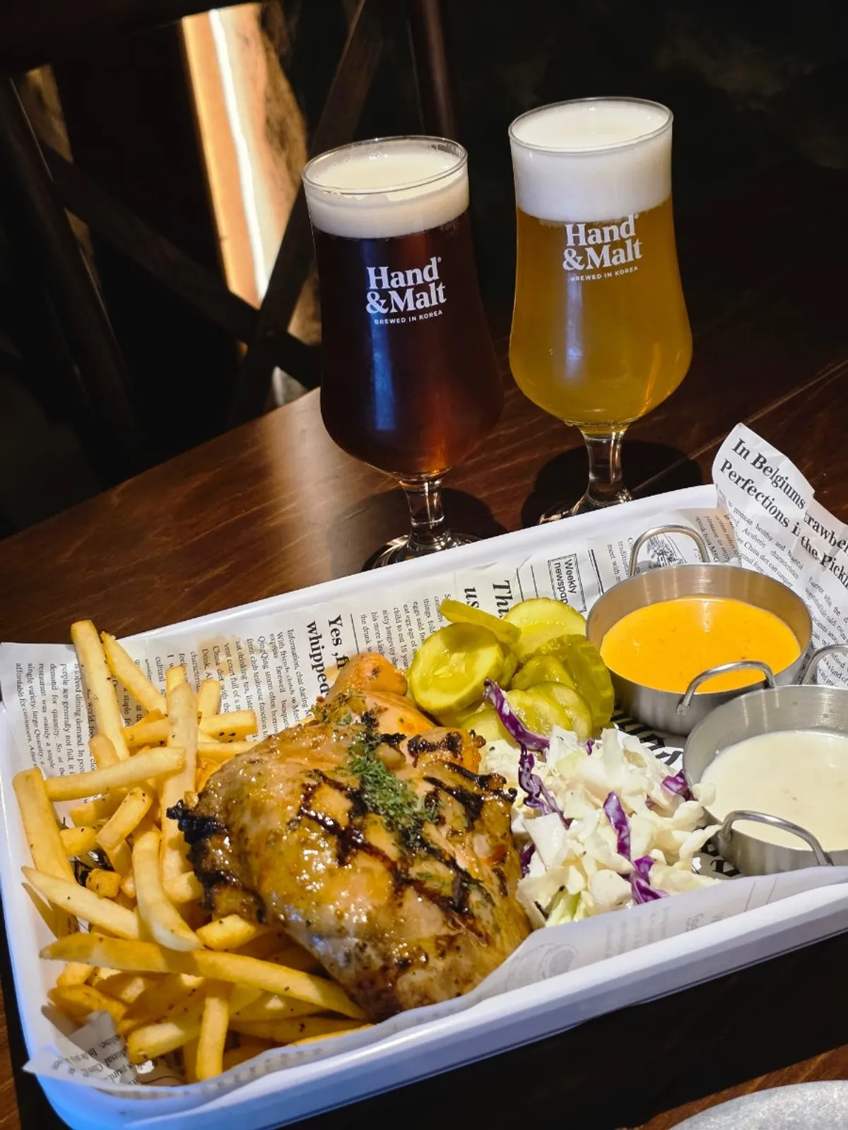 Roast chicken with two glasses of craft beer