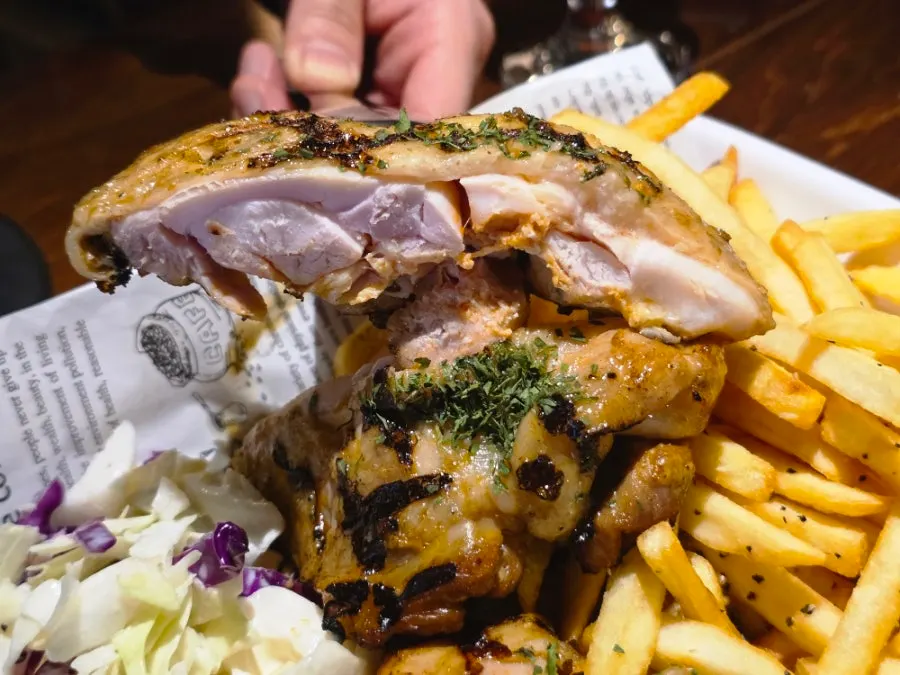 Roast chicken plate served with fries and coleslaw