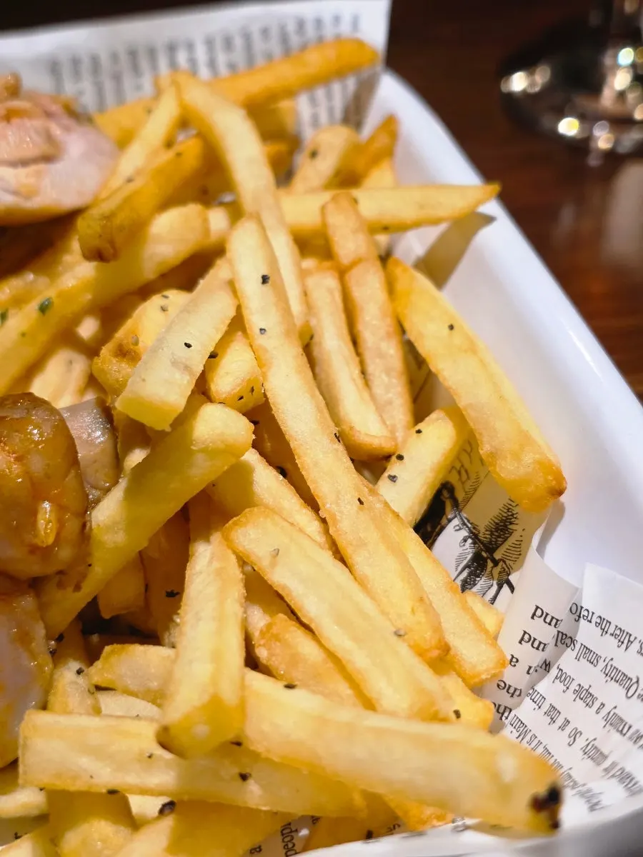 Fries served alongside the roast chicken
