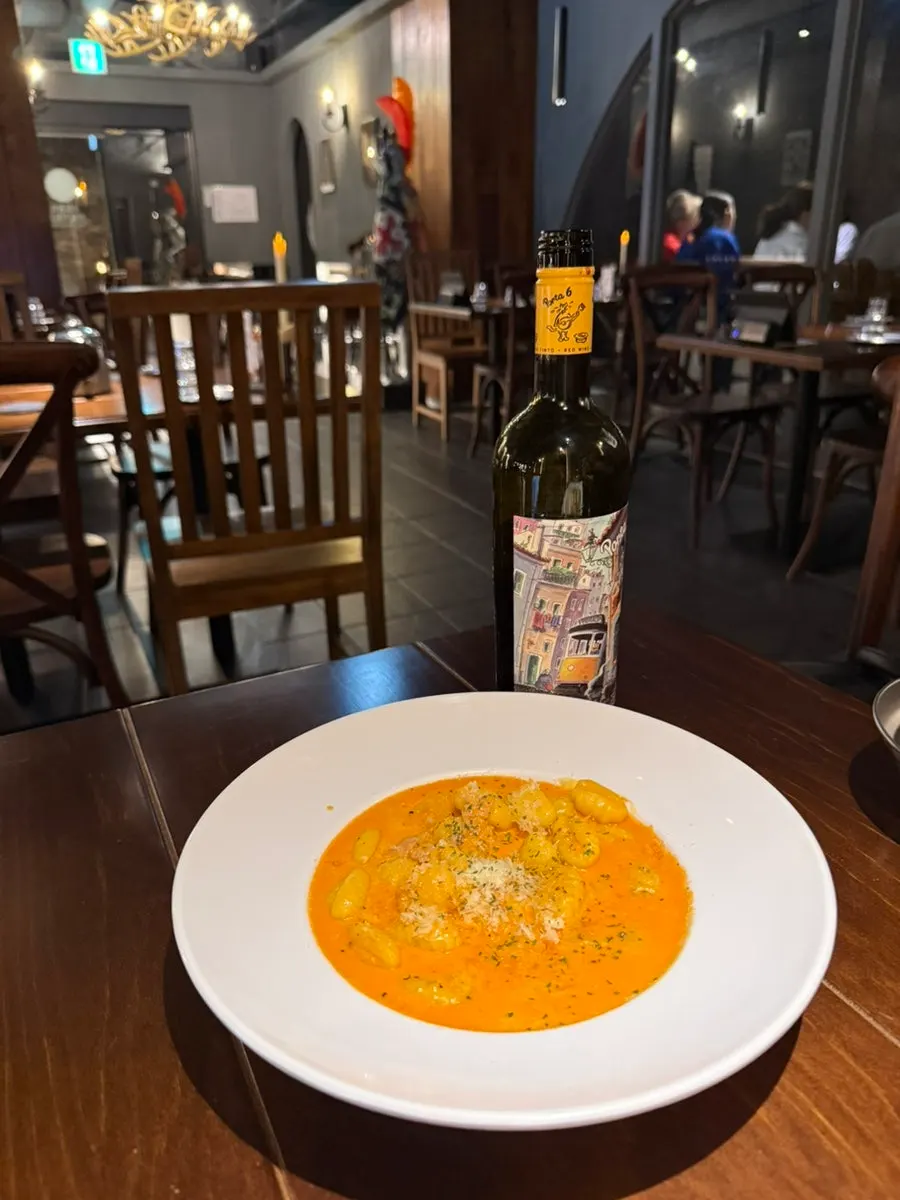 A plate of gnocchi in rich rosé sauce