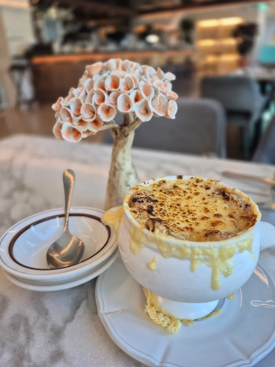 French onion soup topped with Emmental cheese