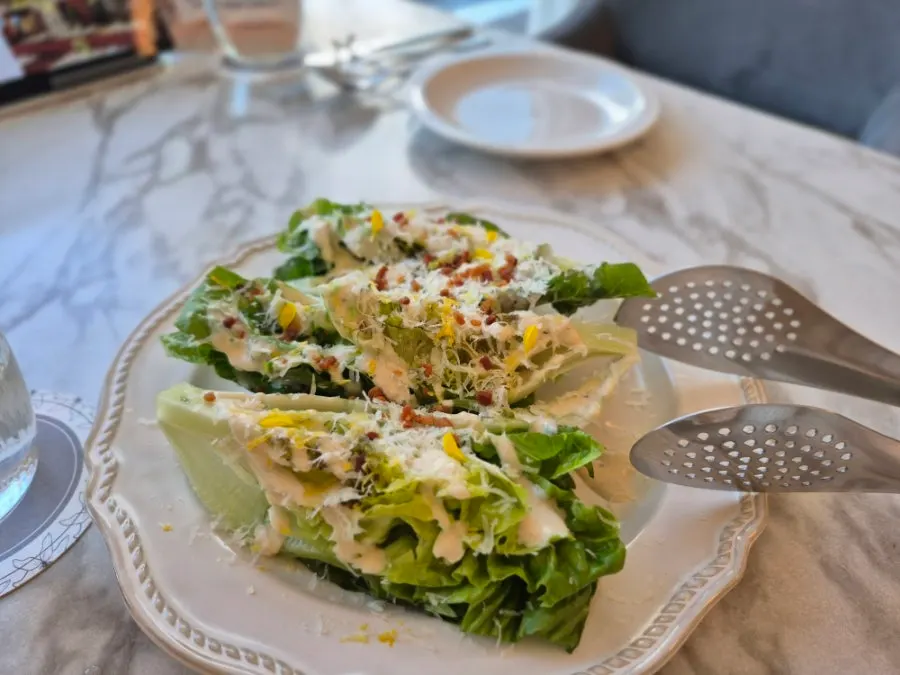 Caesar salad topped with bacon crumble