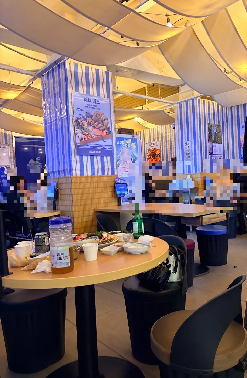 Interior of Parang Haenyeojip with a seaside pub feel