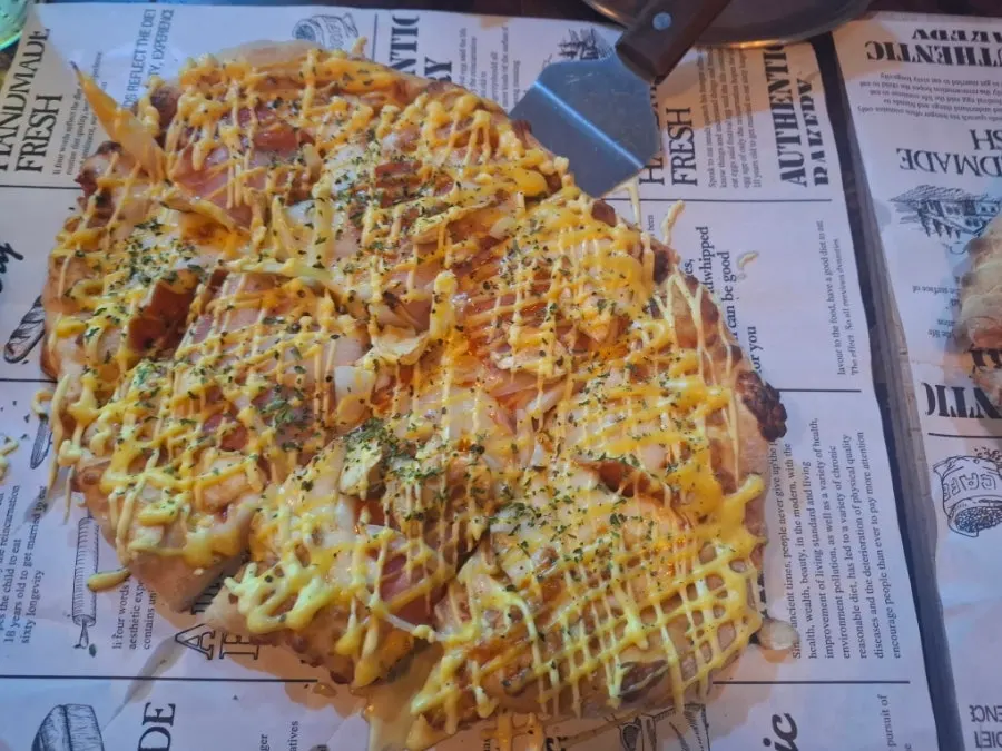 Chewy dough and crisp crust end of the pizza