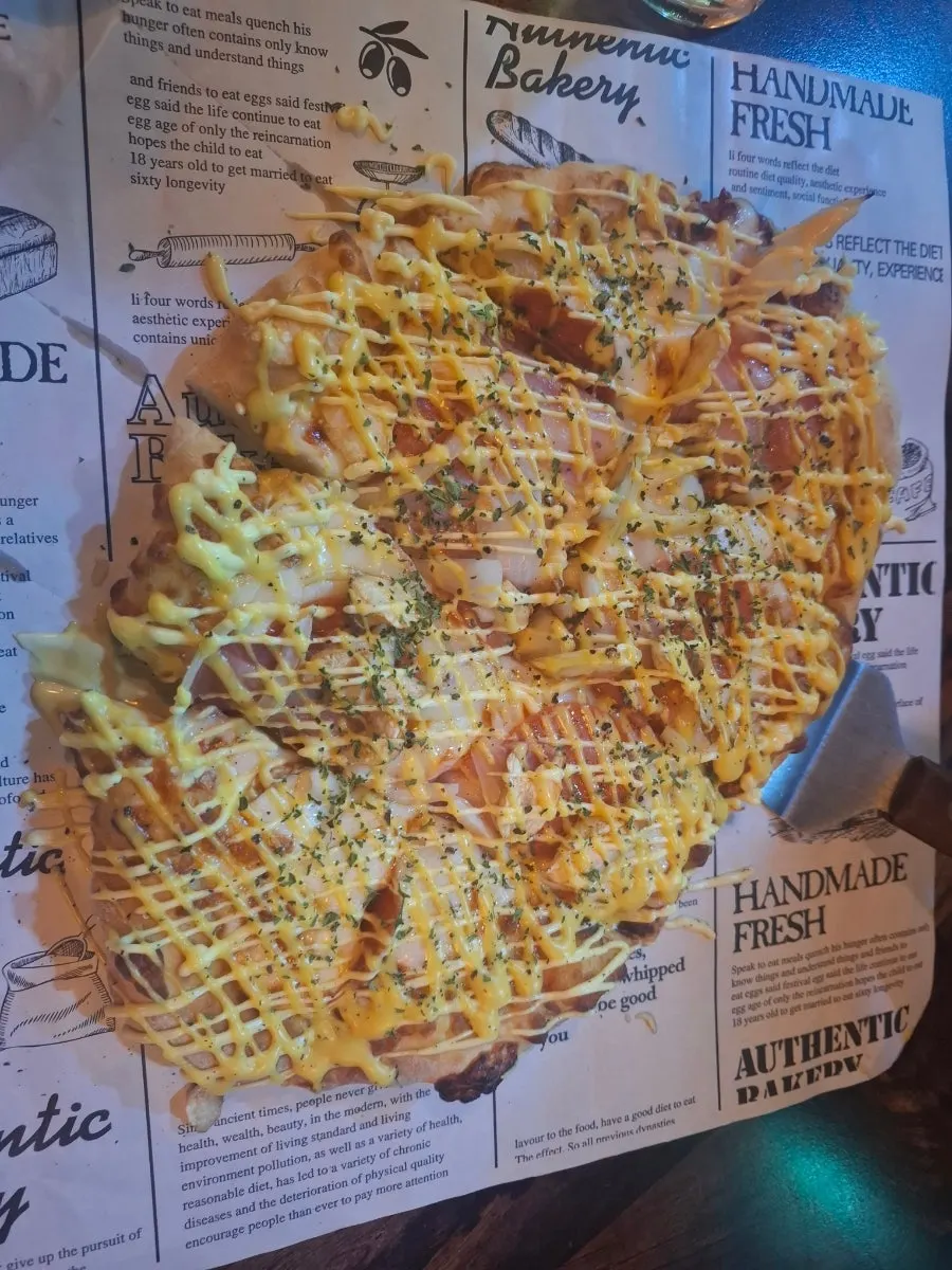Didi's Buldak Pizza topped with fire chicken sauce