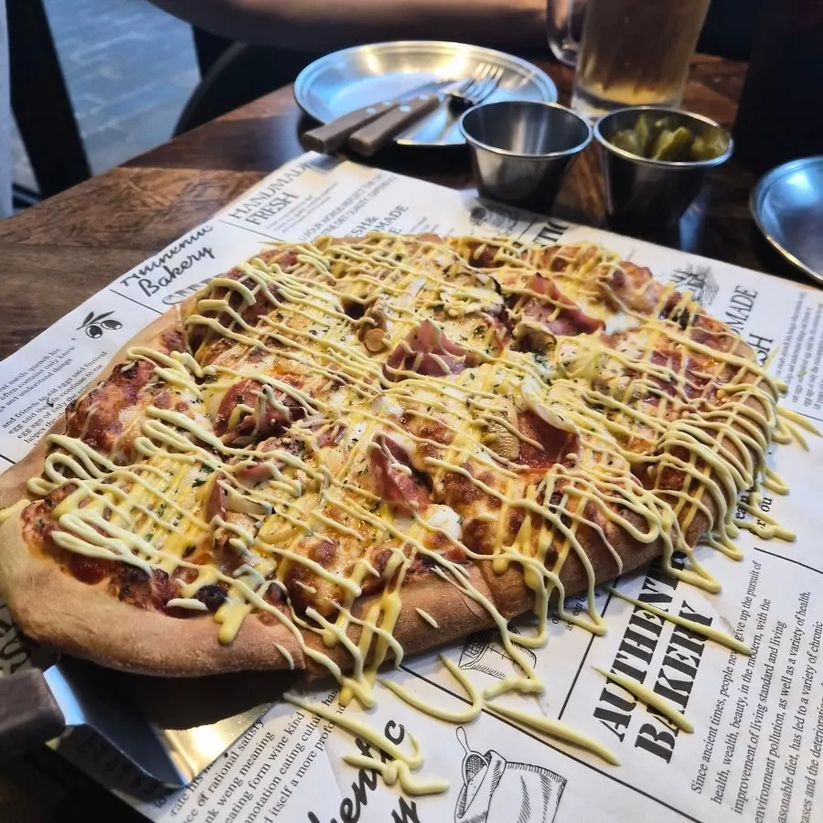 Close-up of cheese-loaded Didi's Pizza