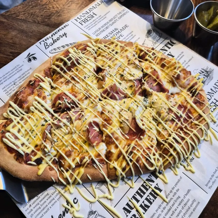 Comparing the size of Didi's Pizza on the table