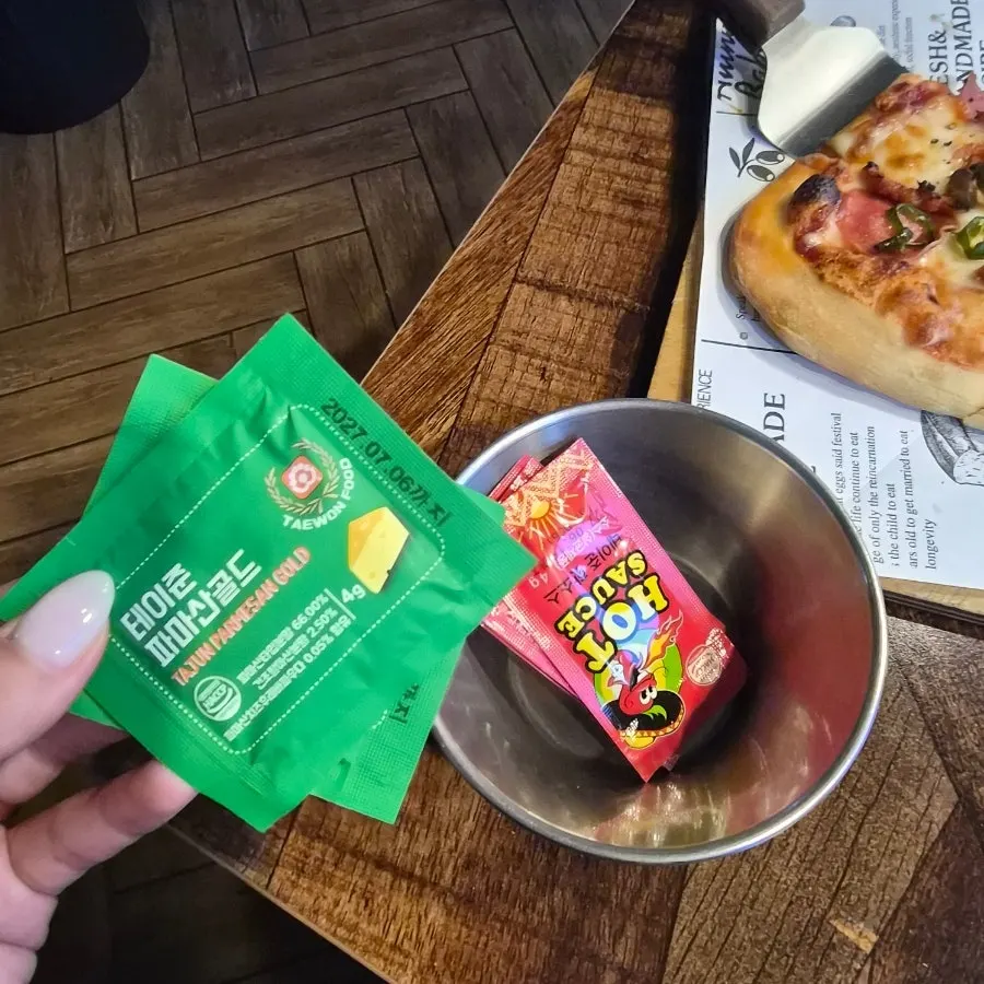 Parmesan cheese and hot sauce requested on the side