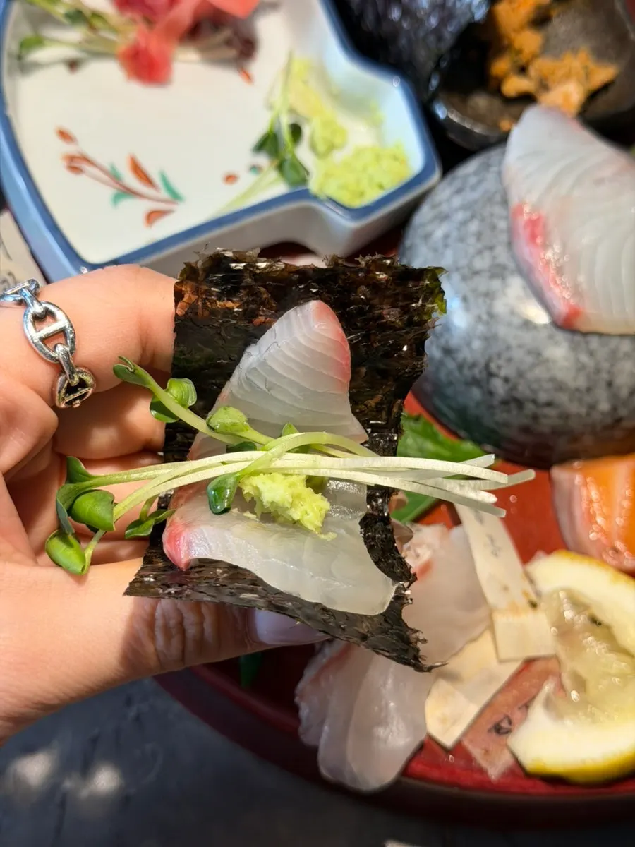 A thickly sliced piece of aged sashimi