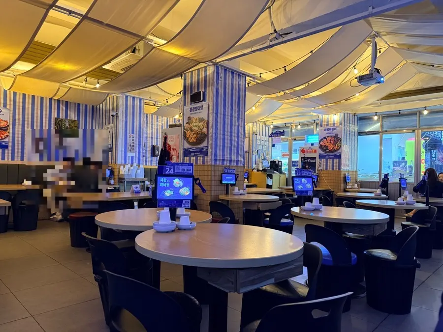 Interior of the restaurant with a haenyeo (female diver) concept