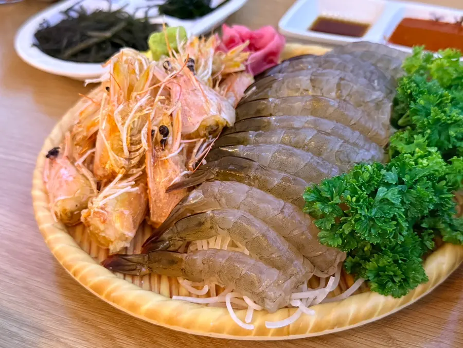 Raw shrimp sashimi served with chojang and soy sauce