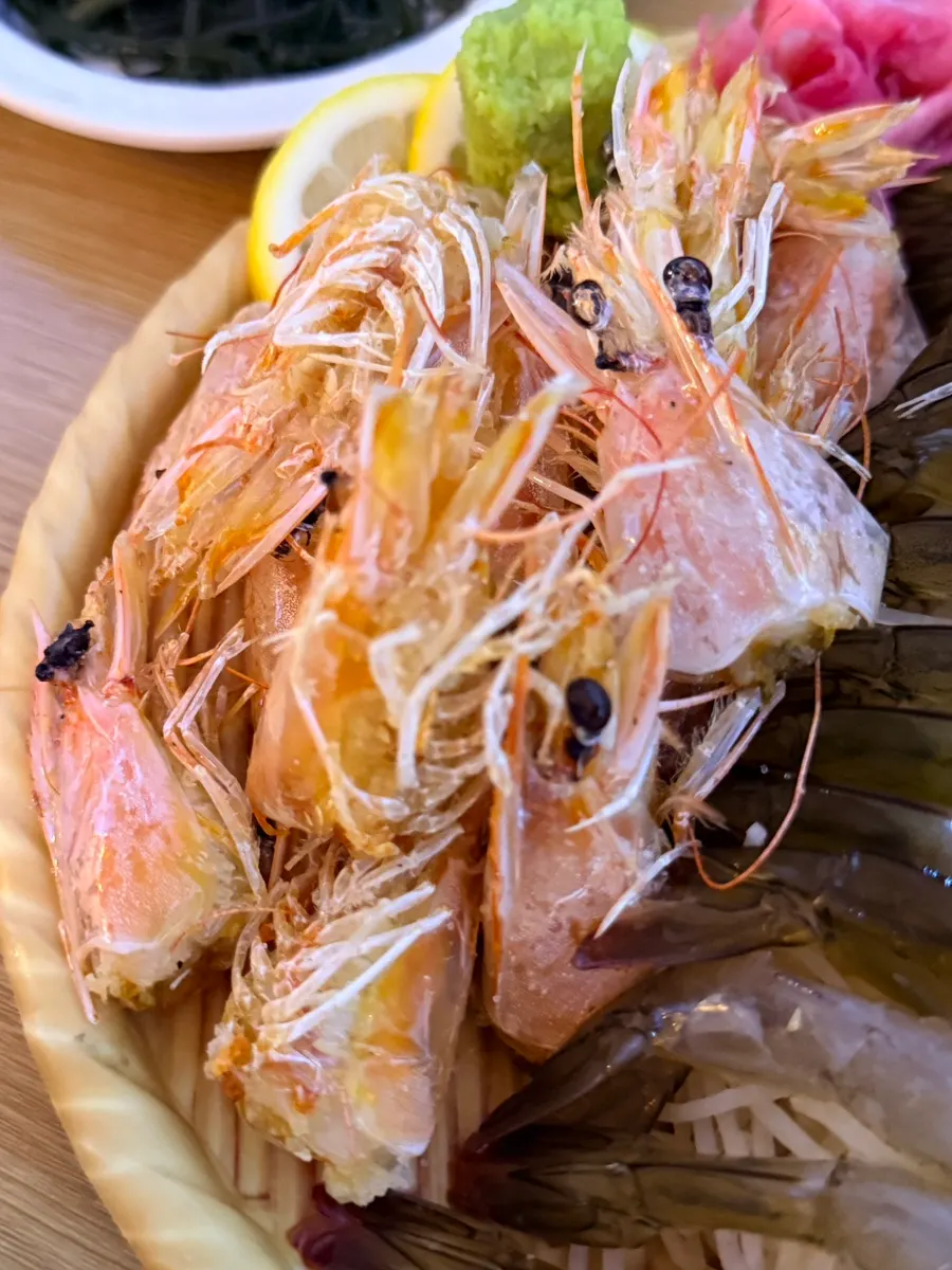 Grilled shrimp head butter served with the raw shrimp sashimi
