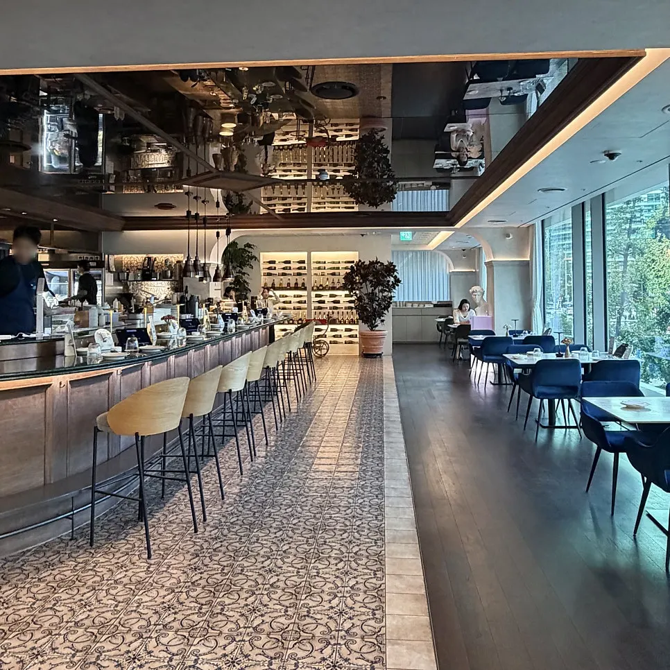 Interior of the high-ceilinged Schedule Osteria dining hall