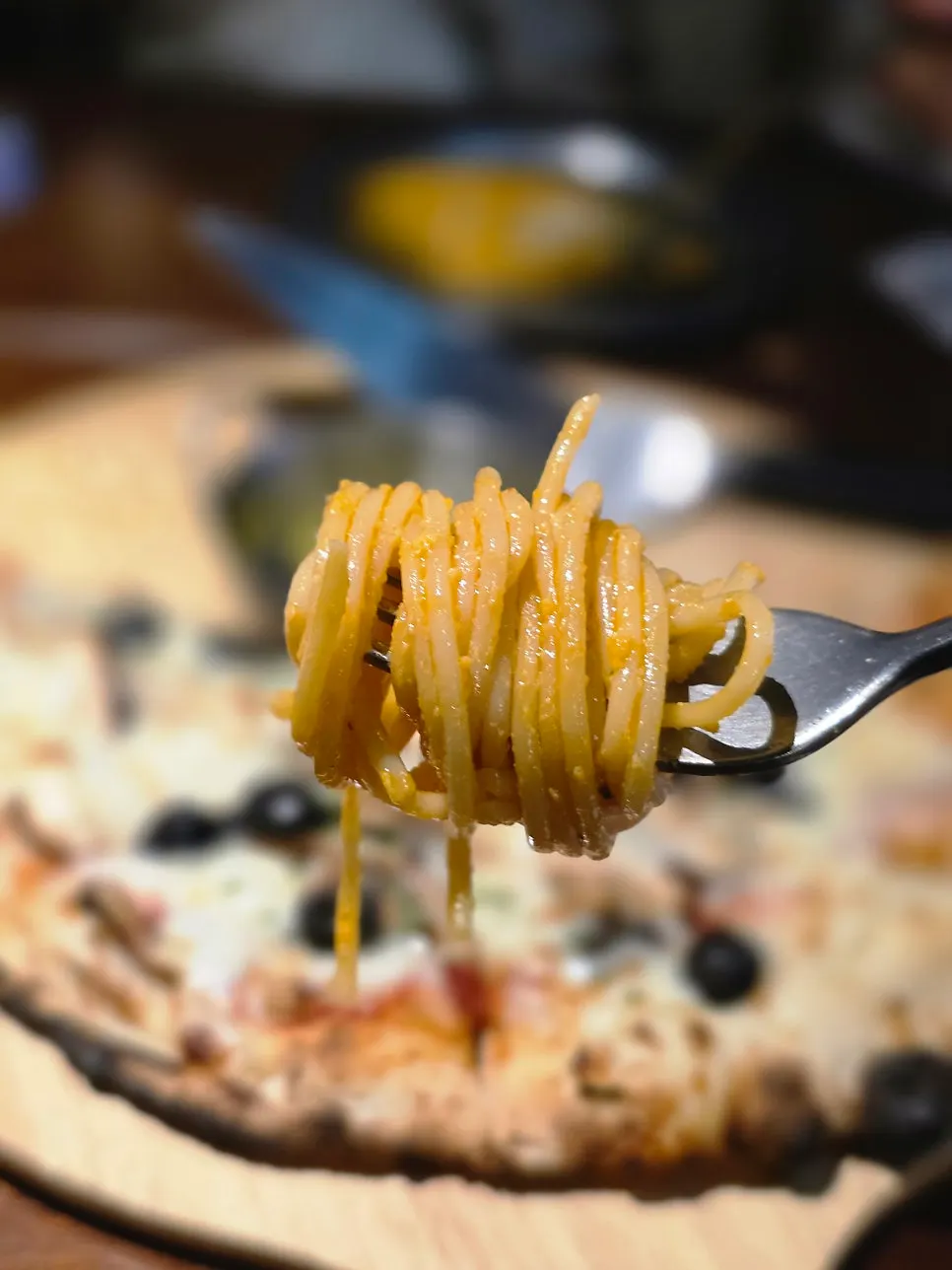 Pizza and pasta arranged for two people to share