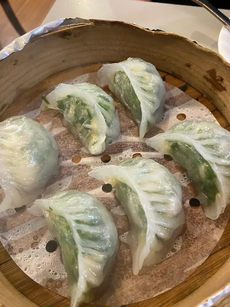 A full spread of beef knife-cut noodles, dim sum, and fish-fragrant eggplant rice