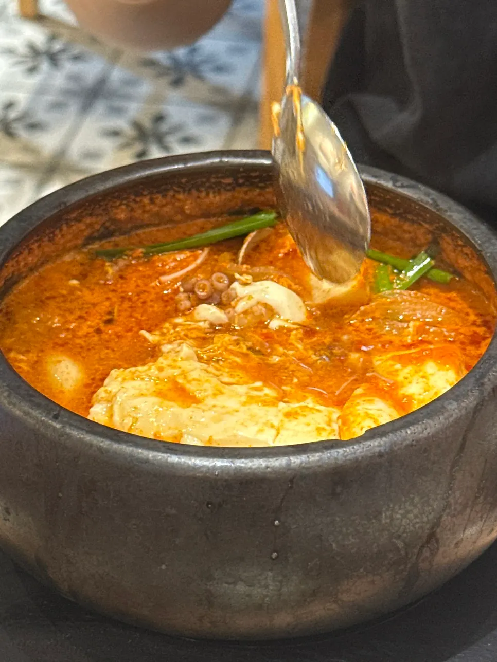 Seafood visible in the soft tofu stew