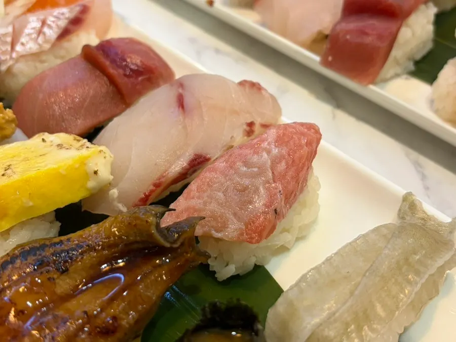 Premium sushi showing tuna belly and gunkan pieces