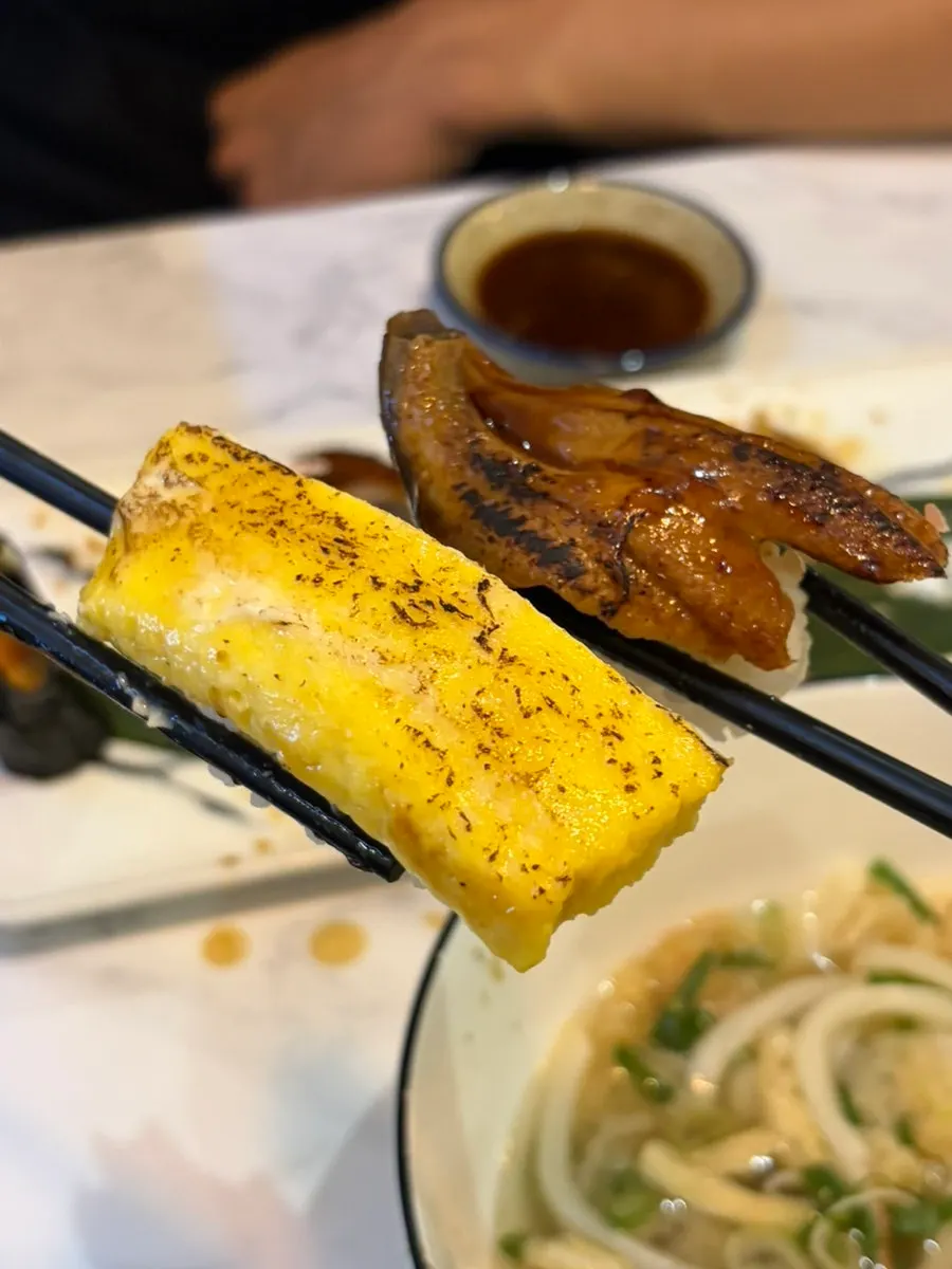 Seared egg sushi and freshwater eel sushi