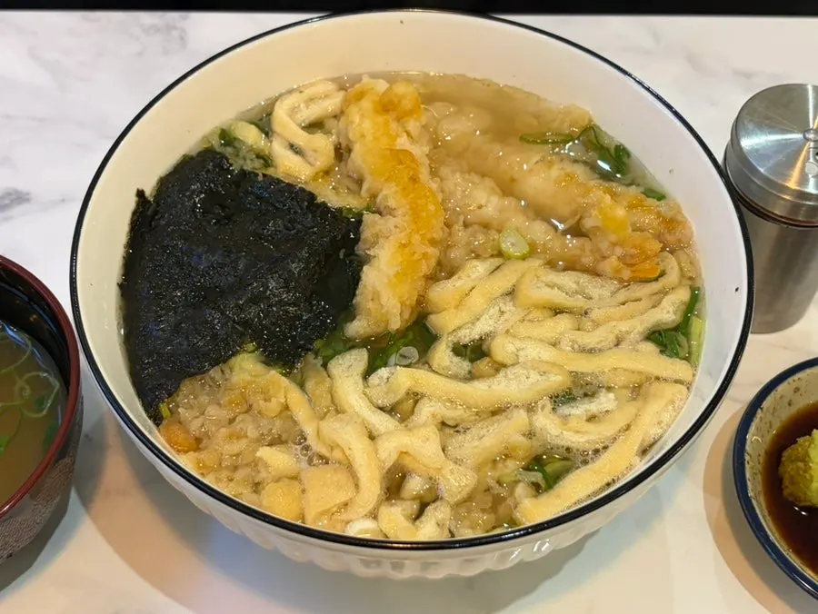 Shrimp tempura udon topped with three pieces of shrimp tempura