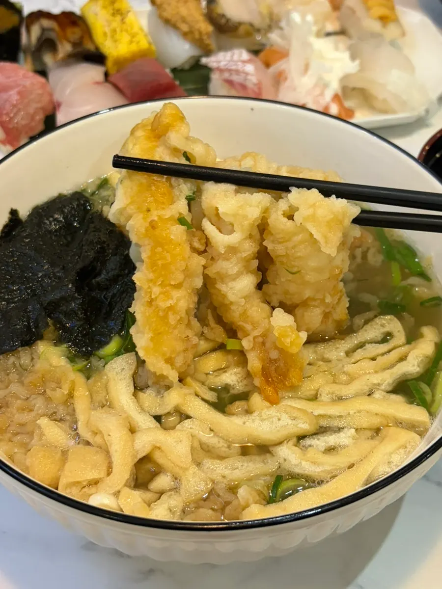 Picking up a large piece of shrimp tempura