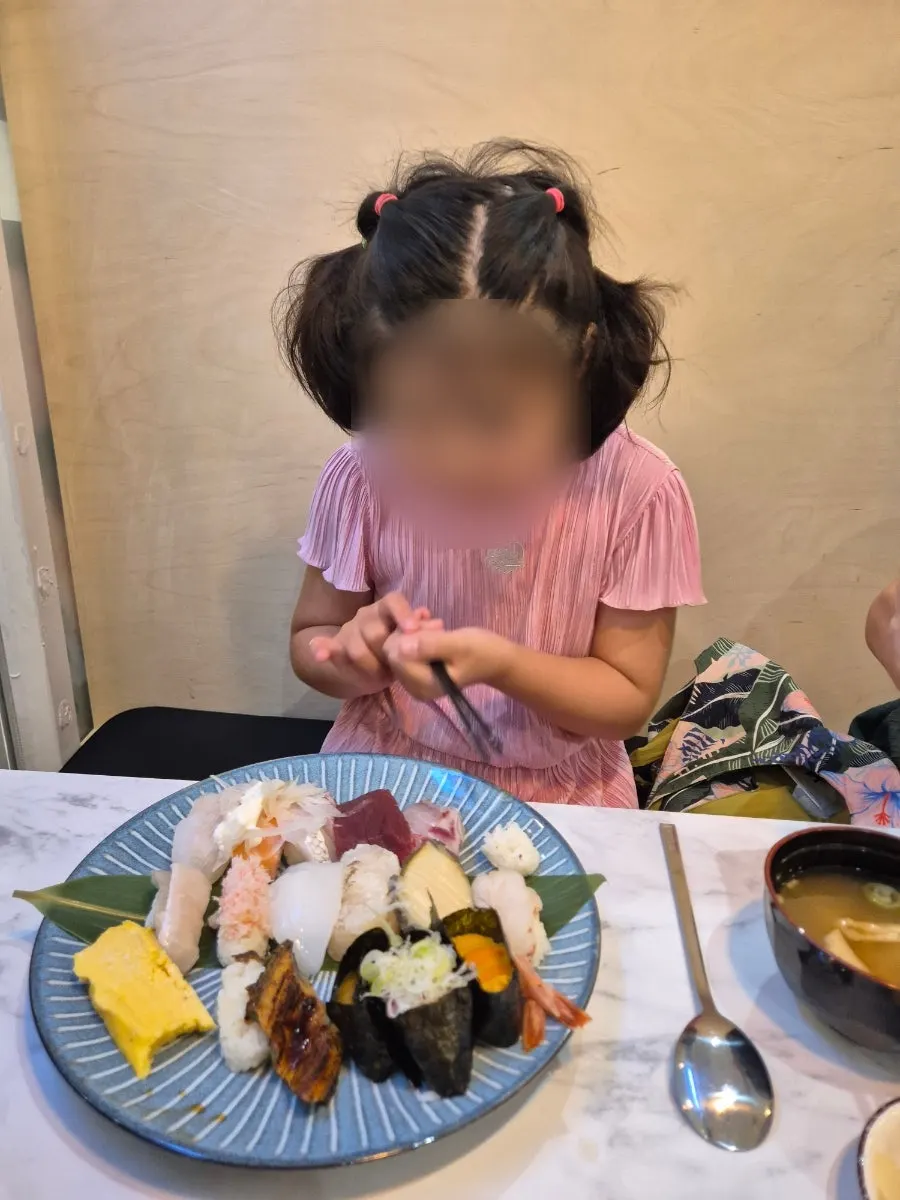 Plate of top sushi shared with the child