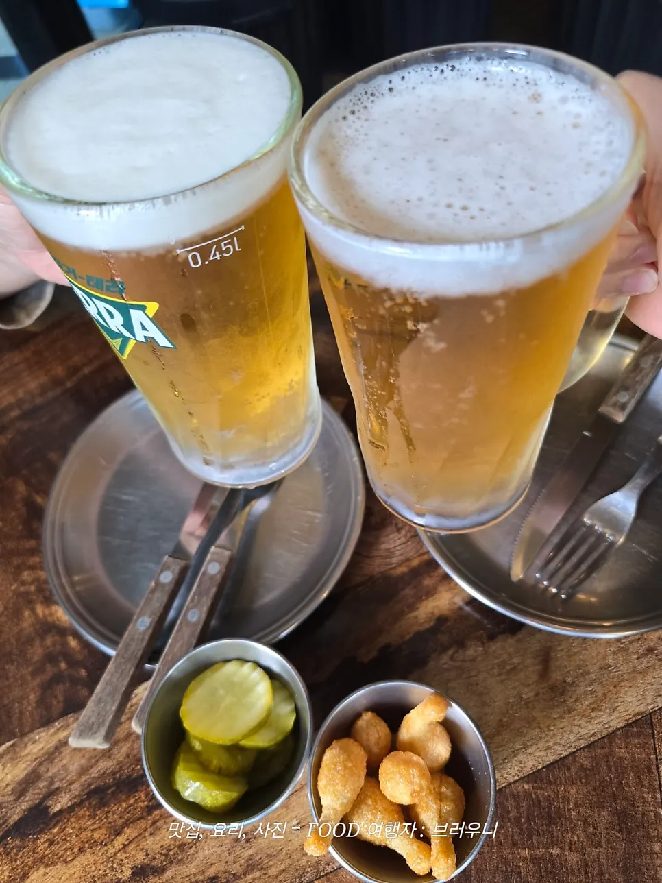 Cold draft beer served with pizza