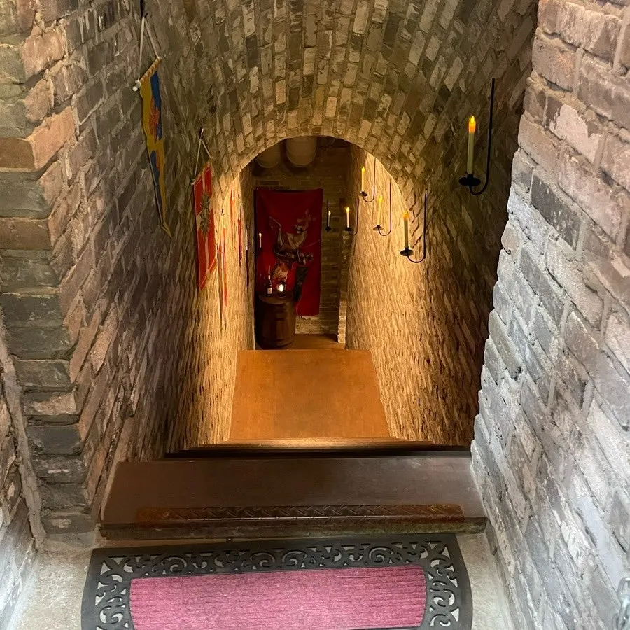 Passage leading down to the basement-level bar