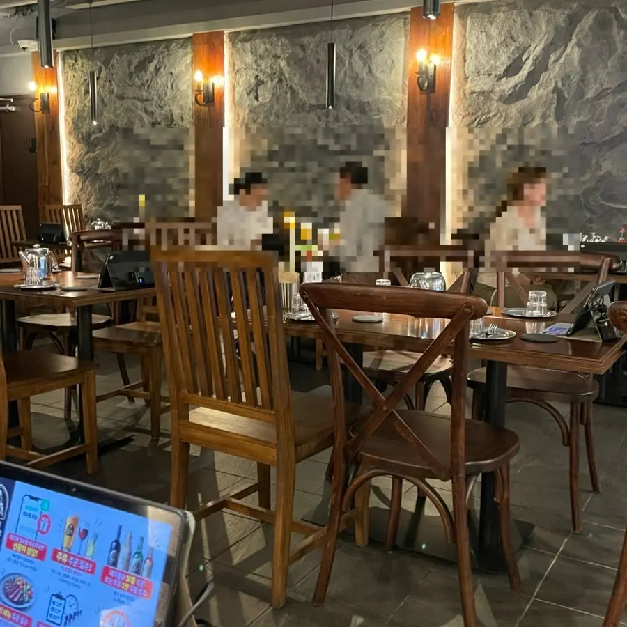 Wooden tables and soft lighting at the seating area