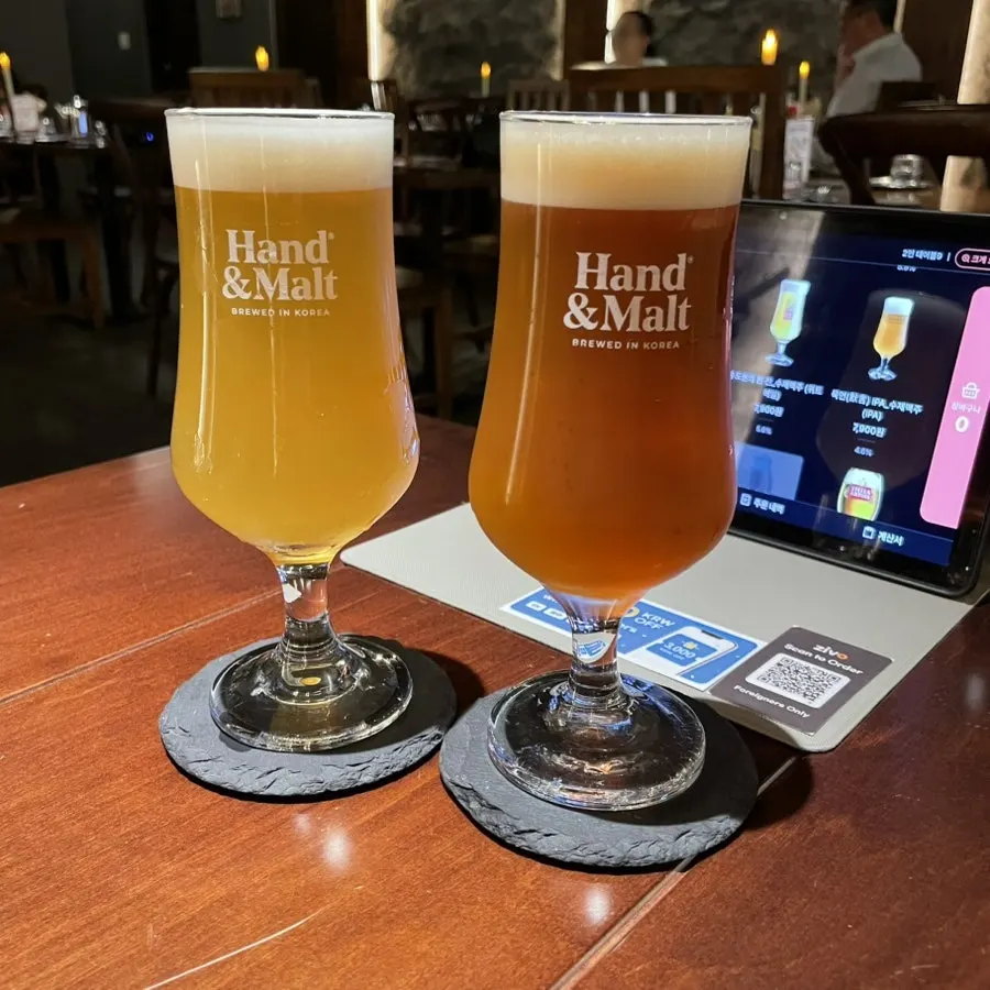 Wheat ale and pale ale served in glasses