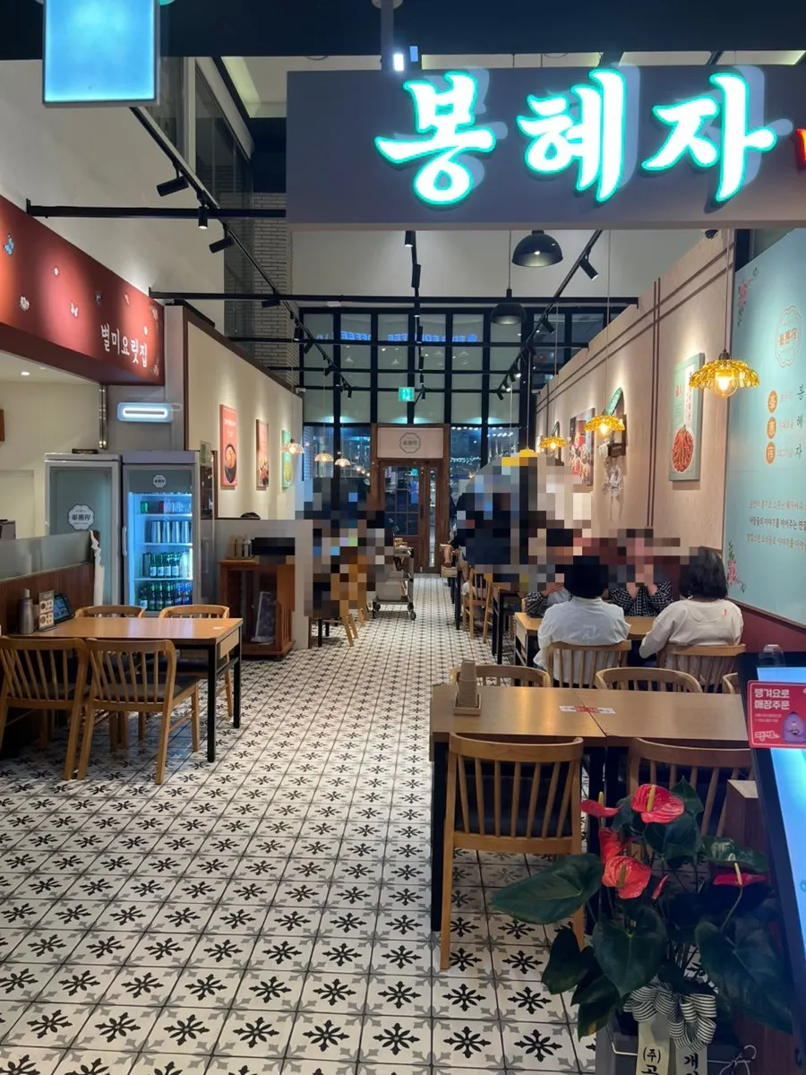 Menu board listing whole octopus stir-fry and other Korean dishes
