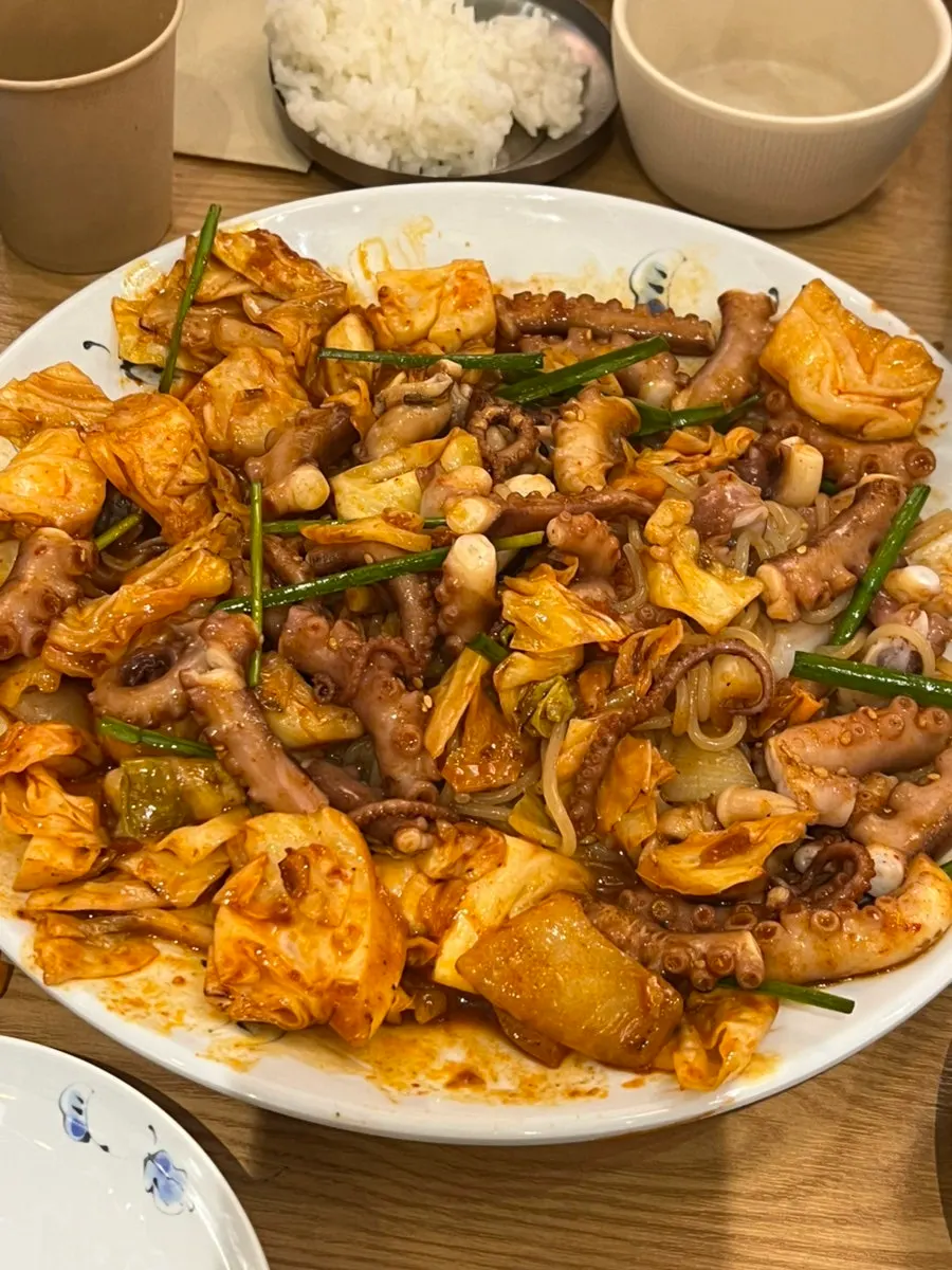 Jjolmyeon mixed into the sauce with the whole octopus stir-fry