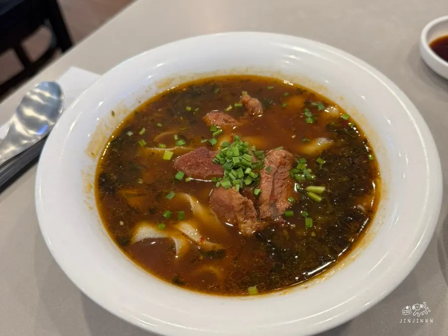 Broth and noodles lifted from the uyuk dosakmyeon bowl