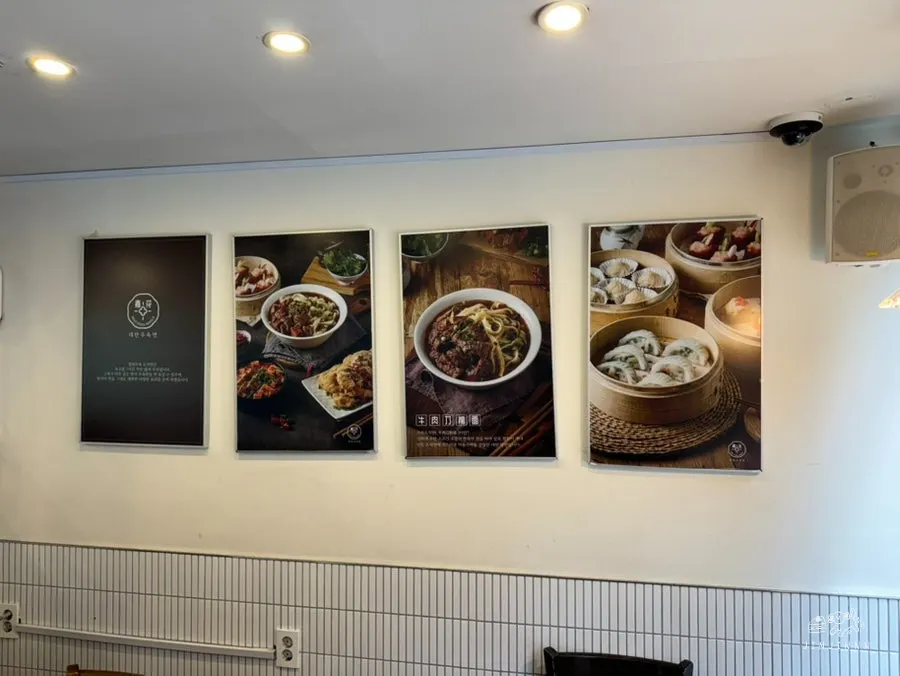 A table set with uyuk dosakmyeon and two kinds of dim sum