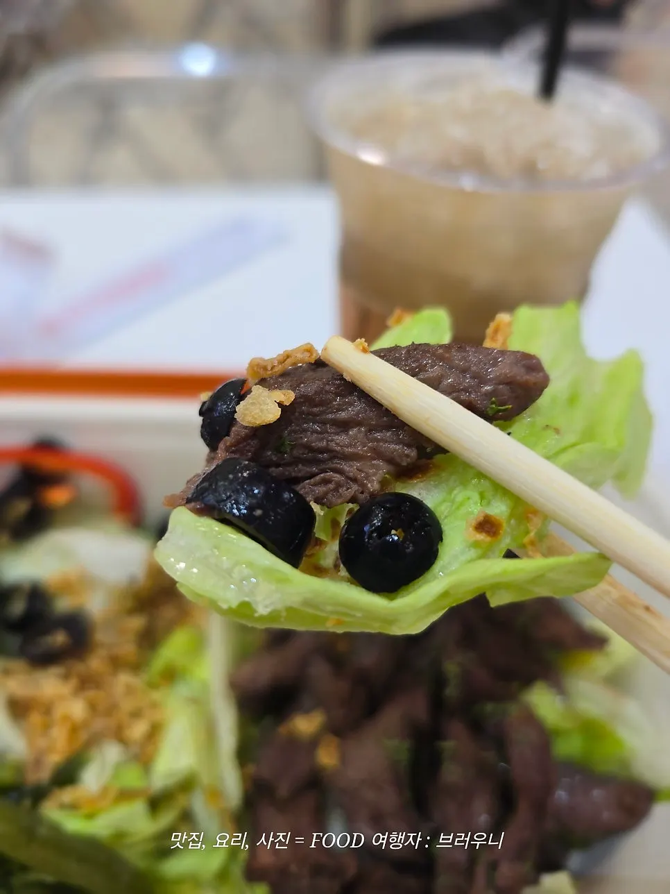 A bite of sous vide beef steak with vegetables