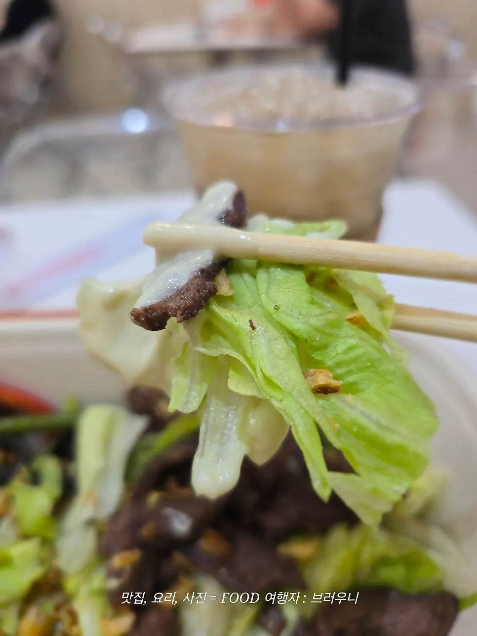 Salad base topped with olives and onion flakes