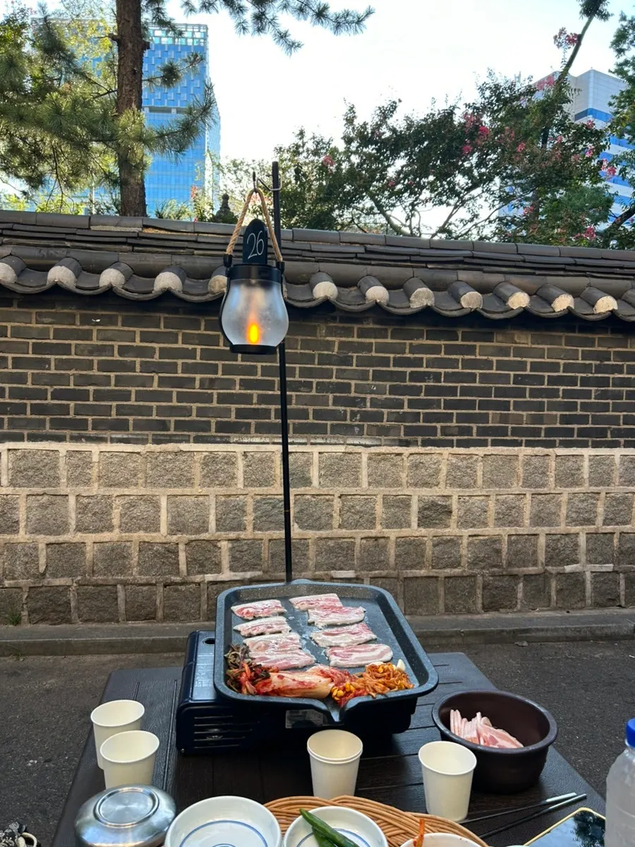 Quick-frozen pork belly being first-seared on the grill