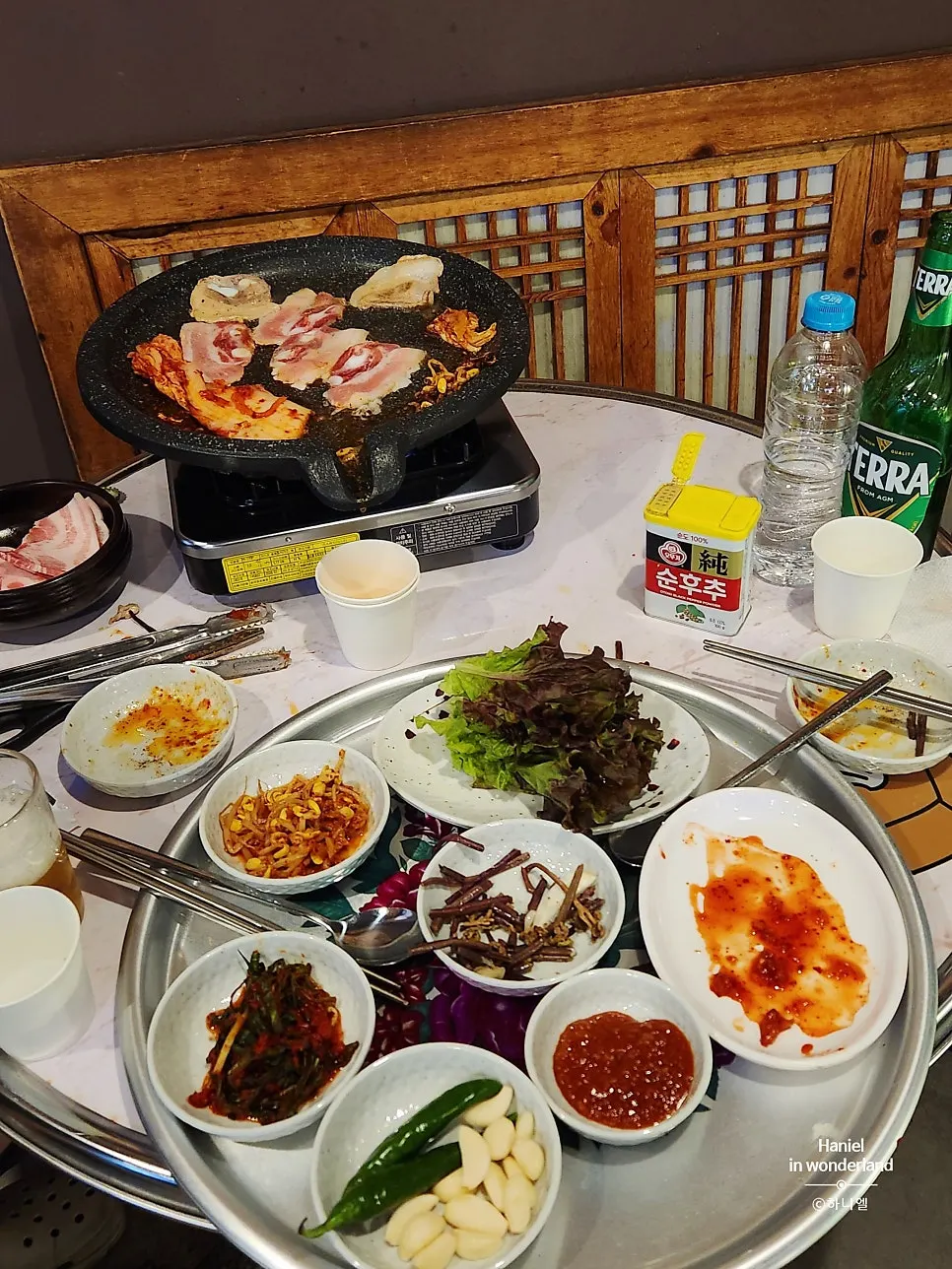 Grilling sweet and tangy kimchi alongside the meat