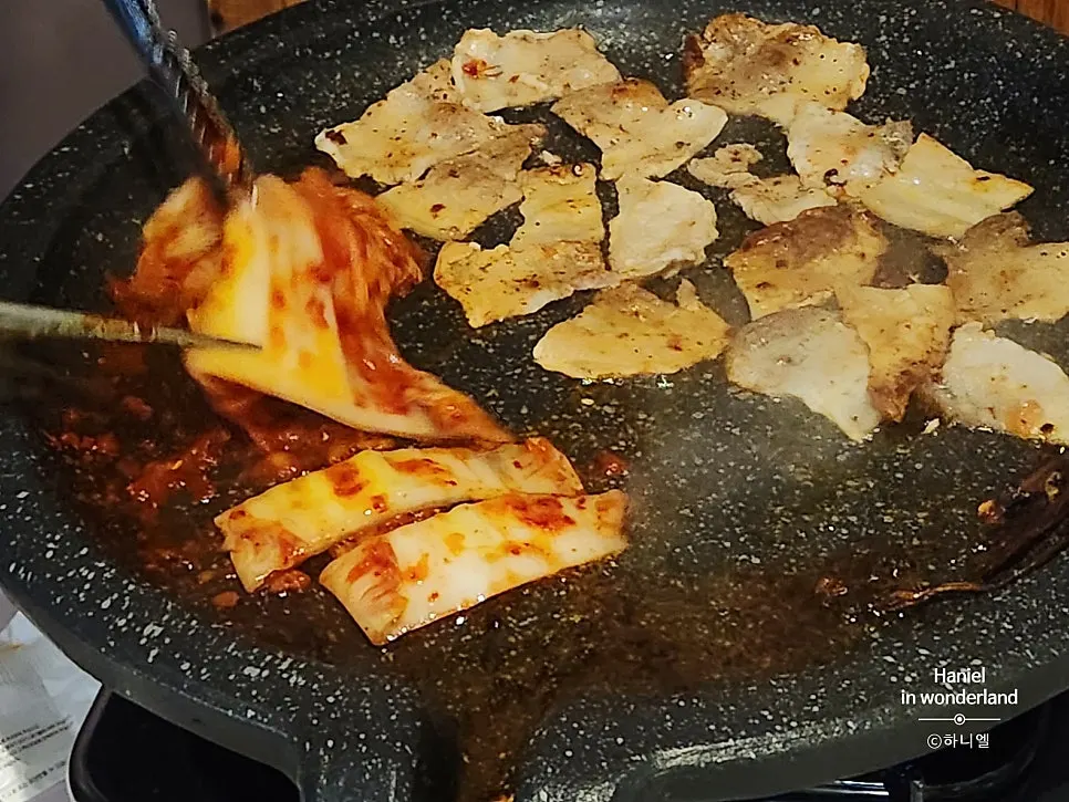 Extra kimchi from the self-serve bar on the grill plate